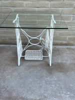 Awesome Glass Top Table Sitting On An Antique Sewing Machine Stand.