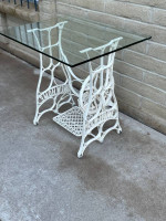 Awesome Glass Top Table Sitting On An Antique Sewing Machine Stand.