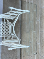 Awesome Glass Top Table Sitting On An Antique Sewing Machine Stand.