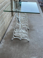 Awesome Glass Top Table Sitting On An Antique Sewing Machine Stand.