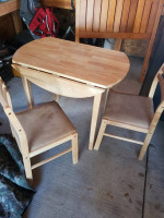 Drop leaf table and padded chairs