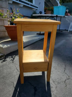 Small wooden table and bissell vacuum cleaner