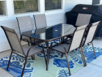 7 Piece Outdoor Furniture Set with 6 Brown Chairs and Table!