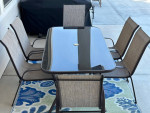 7 Piece Outdoor Furniture Set with 6 Brown Chairs and Table!