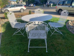 Wrought Iron Table and 4 Rocking Chairs