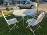 Wrought Iron Table and 4 Rocking Chairs