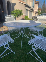 Wrought Iron Table and 4 Rocking Chairs