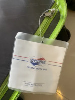 Bright green American Tourister suitcase