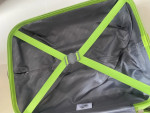Bright green American Tourister suitcase