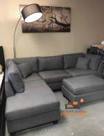 Brand new grey linen Sectional Sofa with ottoman and 2 accent pillows.