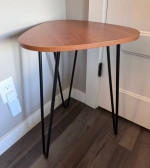 End table with black metal legs