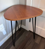 End table with black metal legs