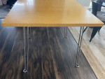 solid wood top table w/ metal legs that folds flat