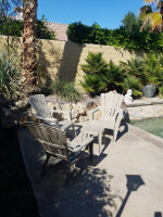 Three Patio stackable plastic chair set and side table