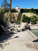 Three Patio stackable plastic chair set and side table