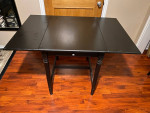 Solid wood black dining table with extensions, chairs