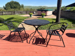 Round outdoor patio table and chairs