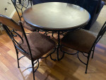 Round wood and wrought iron table with 4 chairs