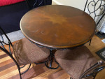 Round wood and wrought iron table with 4 chairs