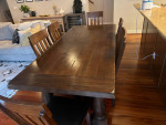 Large wooden dining table with 6 chairs