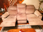 Power reclining sofa with power headrest