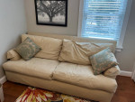 Big soft, cozy, and down-filled sofa couch Beige cotton canvas