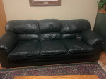 Green leather sofa and recliner.