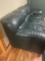 Green leather sofa and recliner.