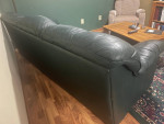 Green leather sofa and recliner.