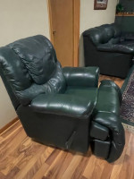 Green leather sofa and recliner.