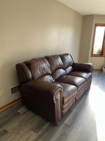 Waukesha Reclining faux leather sofa