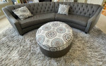 curved sofa tufted couch gray taupe storage ottoman and  pillows