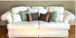 Cream colored sofa with floral pattern