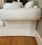 Cream colored sofa with floral pattern