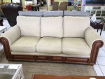 Tan Sofa With Wood and Rattan Trim