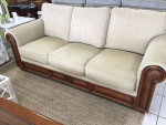 Tan Sofa With Wood and Rattan Trim