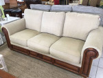 Tan Sofa With Wood and Rattan Trim