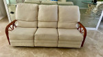 Tropical 3 seat sofa with rattan arms.