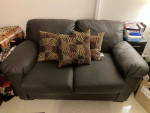 Brown sofa and loveseat