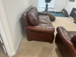 Brown leather sofa and loveseat