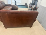 Brown leather sofa and loveseat