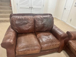 Brown leather sofa and loveseat