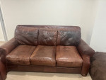Brown leather sofa and loveseat