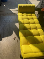 Yellow sectional sofa with pillows and accessories