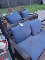 Blue backyard sofa and swivel chairs, glass table
