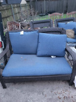 Blue backyard sofa and swivel chairs, glass table