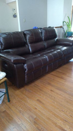 Leather motion reclining sofa. (Moving)