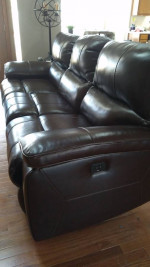 Leather motion reclining sofa. (Moving)