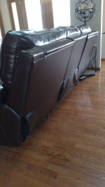 Leather motion reclining sofa. (Moving)