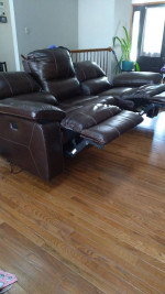 Leather motion reclining sofa. (Moving)